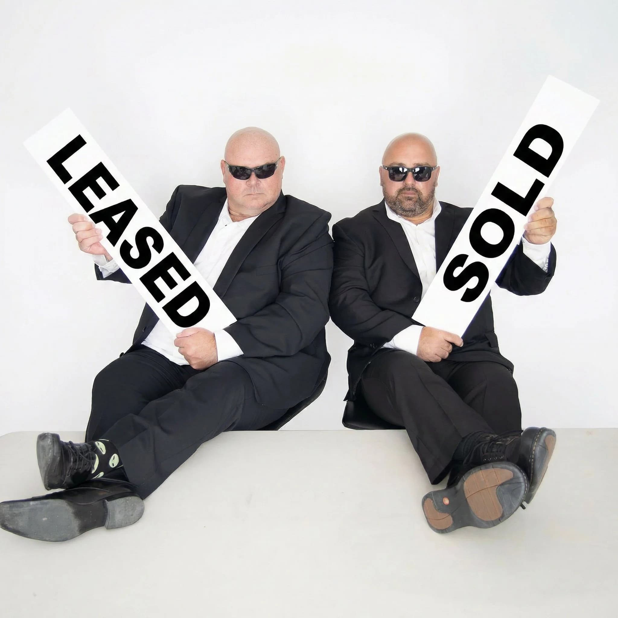 Jason Manaigre and Scott Chabluk, the two REALTORS of MIB Division, standing side by side in professional attire
